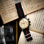 Seagull 1963 Black Edition flat lay, full black NATO strap with red stripe and steel RED STAR buckle