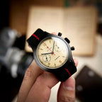 Seagull 1963 black case held in hand, cream dial close-up with the raised edge of the boxed sapphire crystal