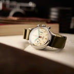 Seagull 1963 Lume 38mm at an angle on a notebook, domed crystal, knurled crown and pump pushers