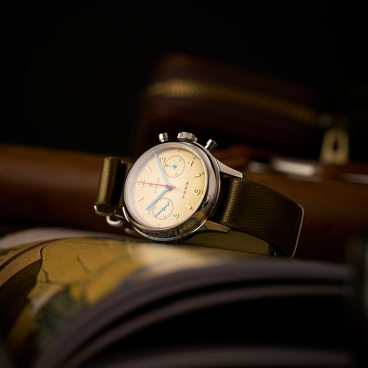 Seagull 1963 38mm low angle on a wooden desk, domed crystal profile and pushers in view