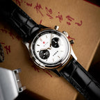 Seagull 1963 White Panda 40mm angled on a kraft box with red calligraphy, boxed crystal edge showing
