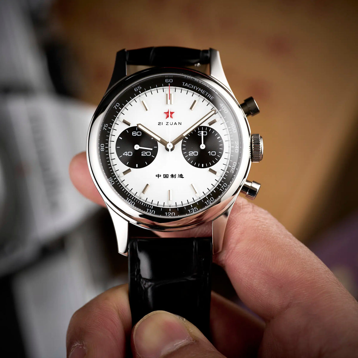 Seagull 1963 White Panda 40mm dial in hand, concentric black subdials and applied silver batons