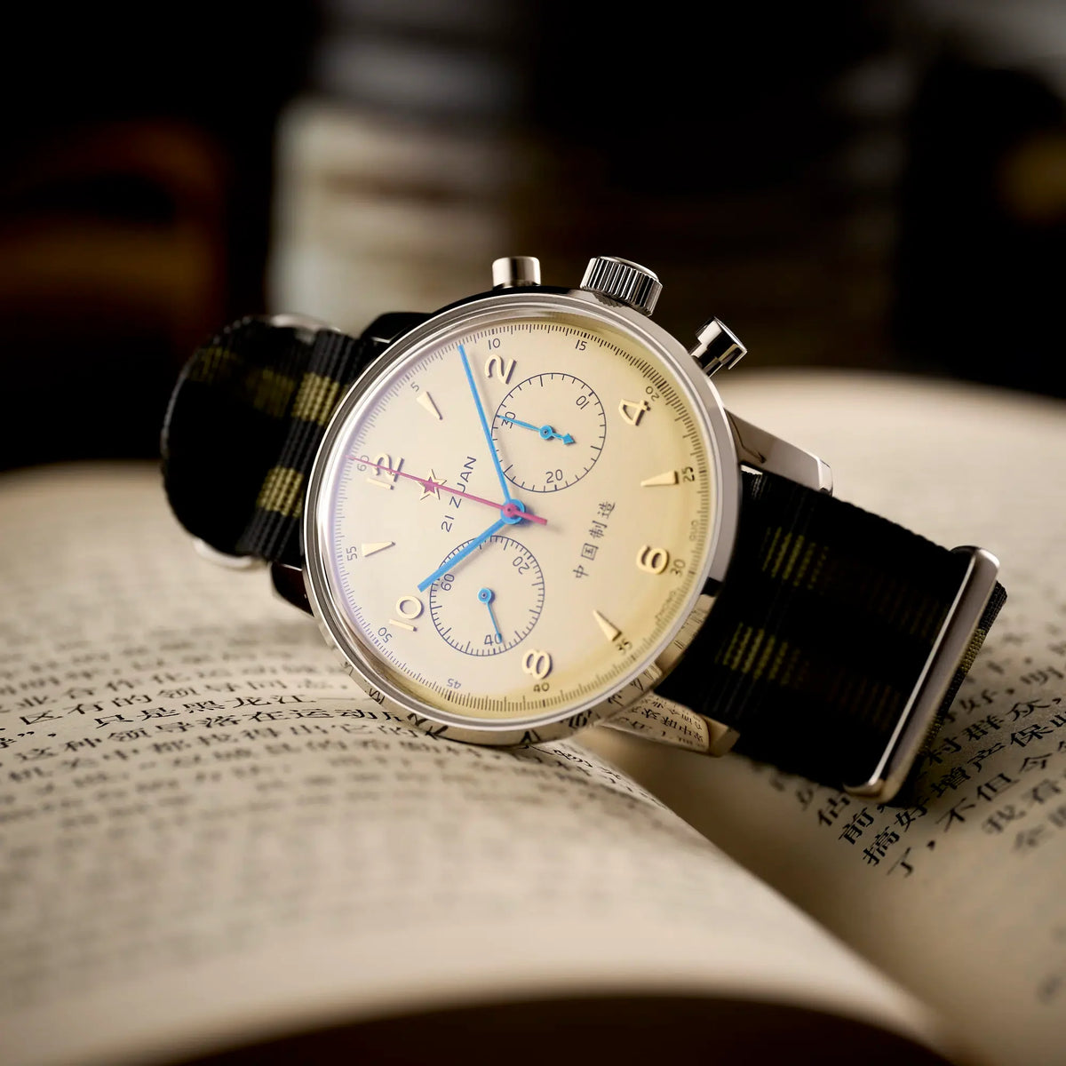 Seagull 1963 Air Force Cream 42mm resting on a Chinese text book, raised crystal and fluted crown