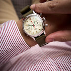 Seagull 1963 Lume 38mm on the wrist under a striped shirt cuff, cream dial, red chronograph hand