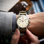 Seagull 1963 Air Force Cream 40mm on the wrist under a grey jacket cuff, olive nylon strap