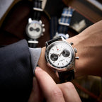 Seagull 1963 White Panda 40mm worn under a grey jacket sleeve on its black croc-embossed strap