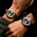 Seagull 1963 Icon II Blue and its green bronze sibling glowing on two wrists side by side
