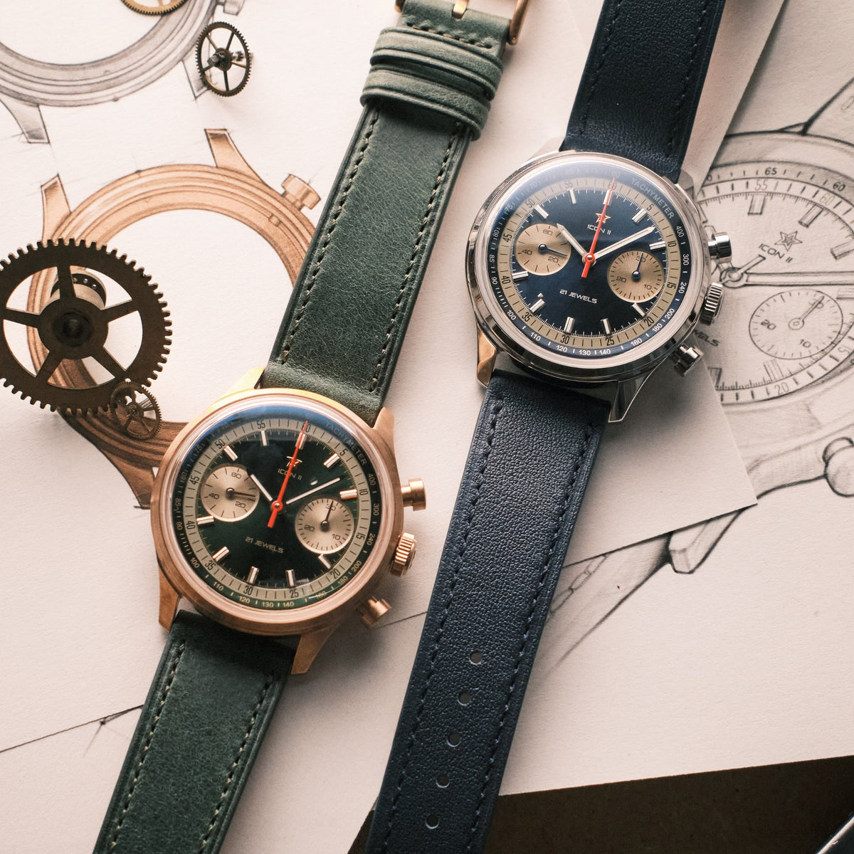 Seagull 1963 Icon II Blue and the green bronze version laid over the pencil design sketches