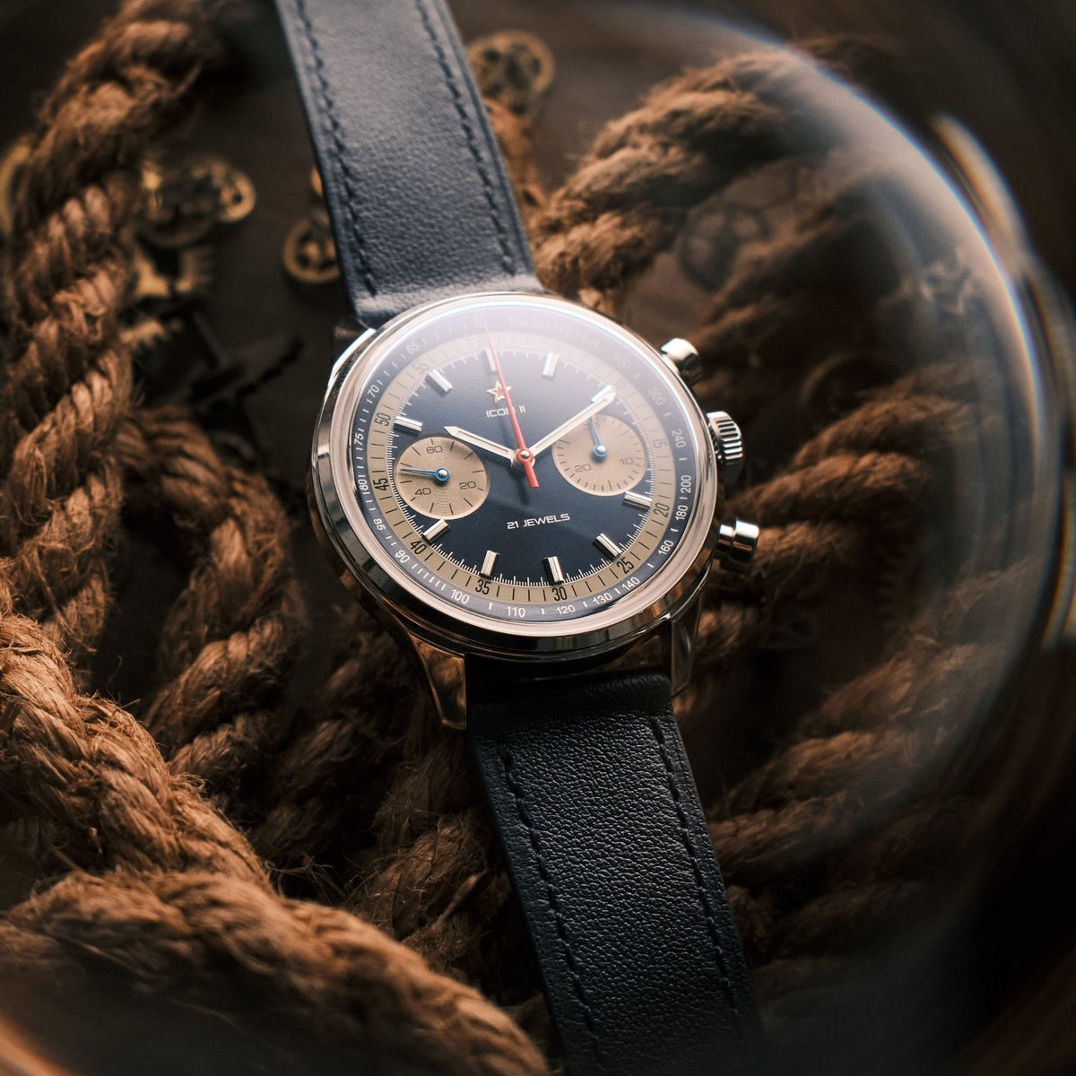 Seagull 1963 Icon II Blue lying on rope and loose watch parts, dial and red star visible