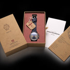 Seagull 1963 Icon II Blue with the kraft box lid, manual, warranty card and hang tag laid out