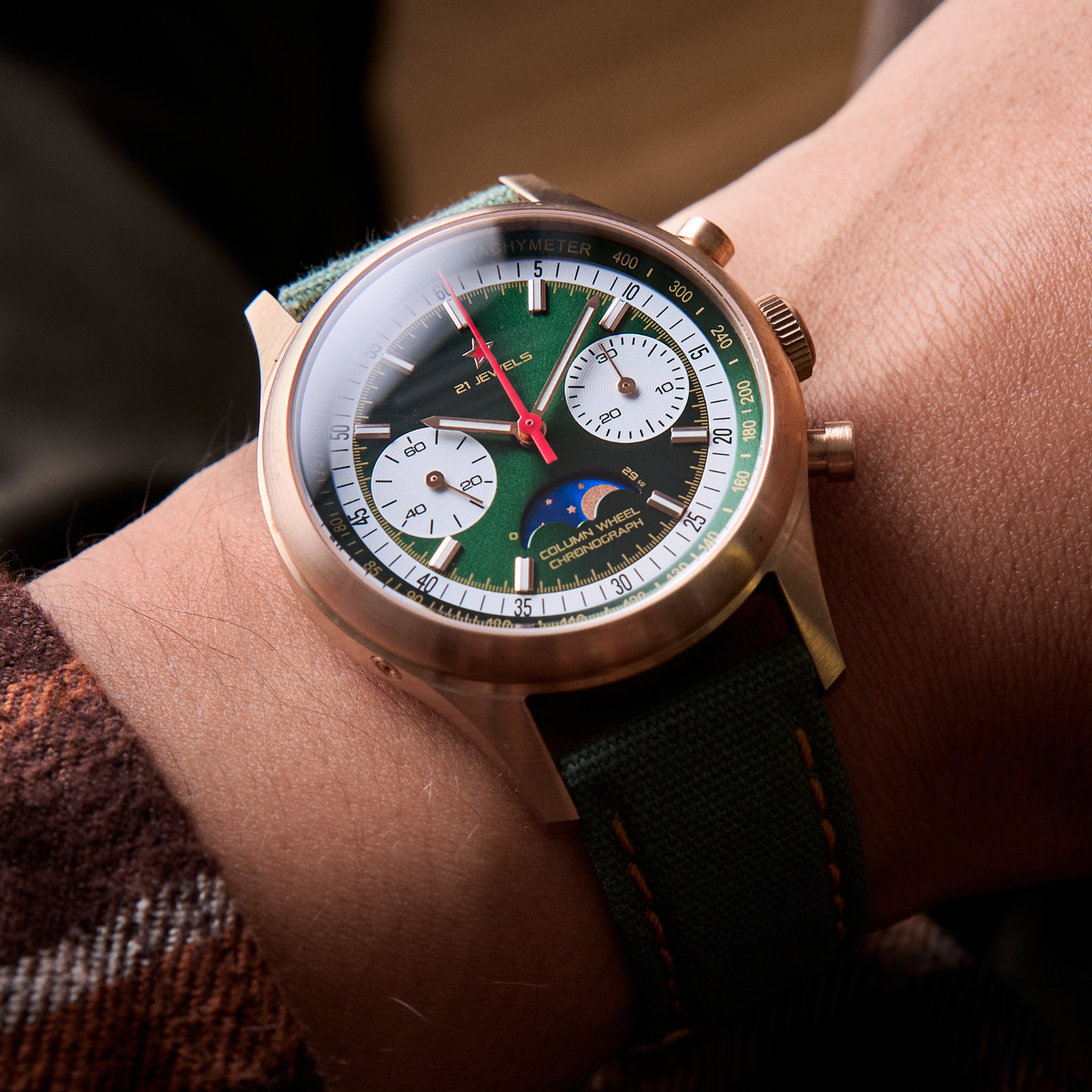 Seagull 1963 The Icon bronze on the wrist, dial angled, moon disc and rose gold batons in view