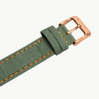 Seagull 1963 The Icon bronze strap close-up, green canvas with orange stitching and fabric keepers